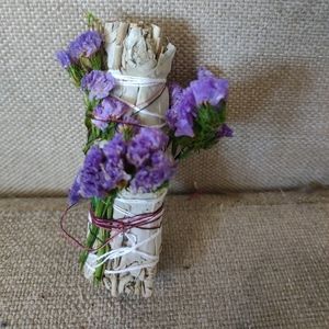 Burning sage with dried flowers and negative energy repellent essential …